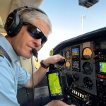 Kevin Rideout makes preflight checks before transporting a team from Hope Springs International in Niger.