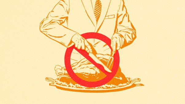 A man cutting a cancel symbol instead of a turkey.