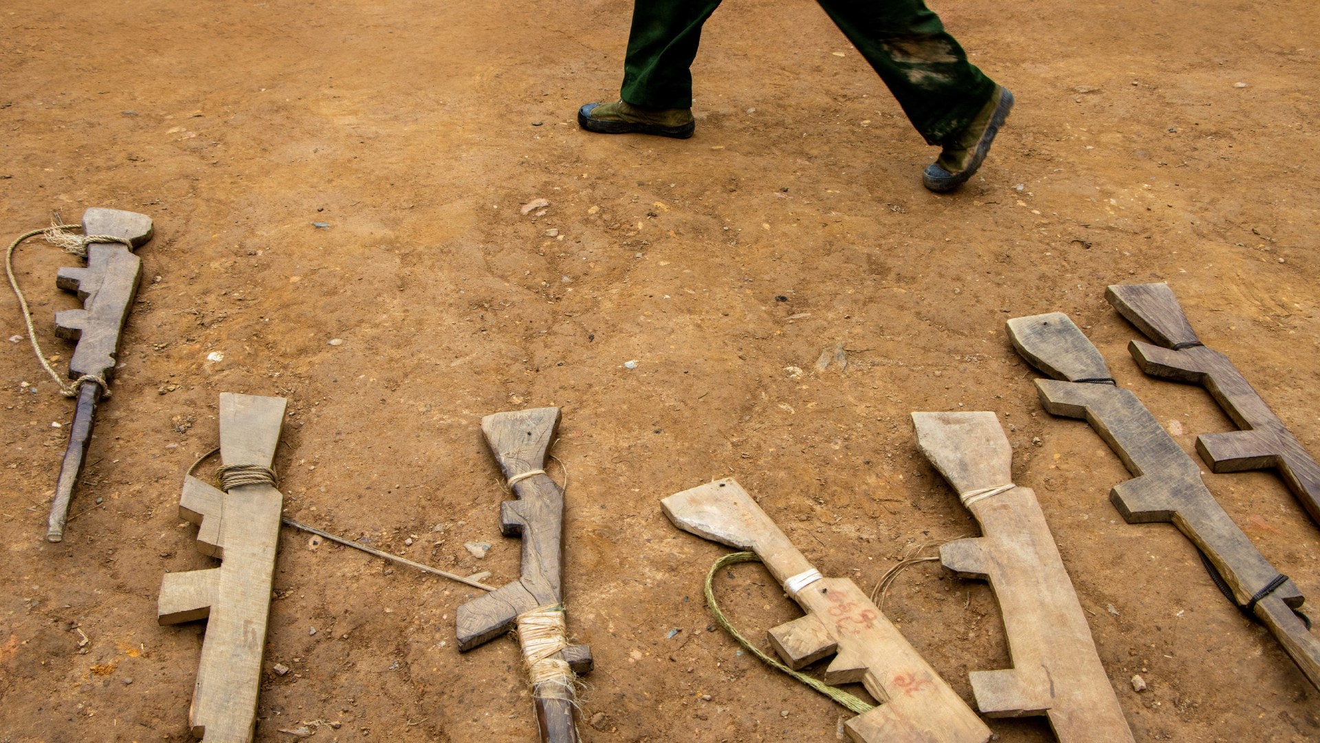 Wooden drill rifles at a camp in Myanmar in 2022.