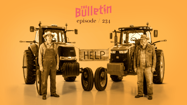 Two farmers standing in front of tractors and holding a sign that says "Help."