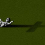 Baby Jesus and a cross shadow.