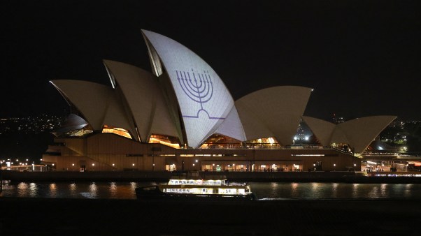 A Hanukkah menorah is projected onto the sails of the Sydney Opera House in memory of the victims of the shooting at Bondi Beach in Sydney on December 15, 2025.