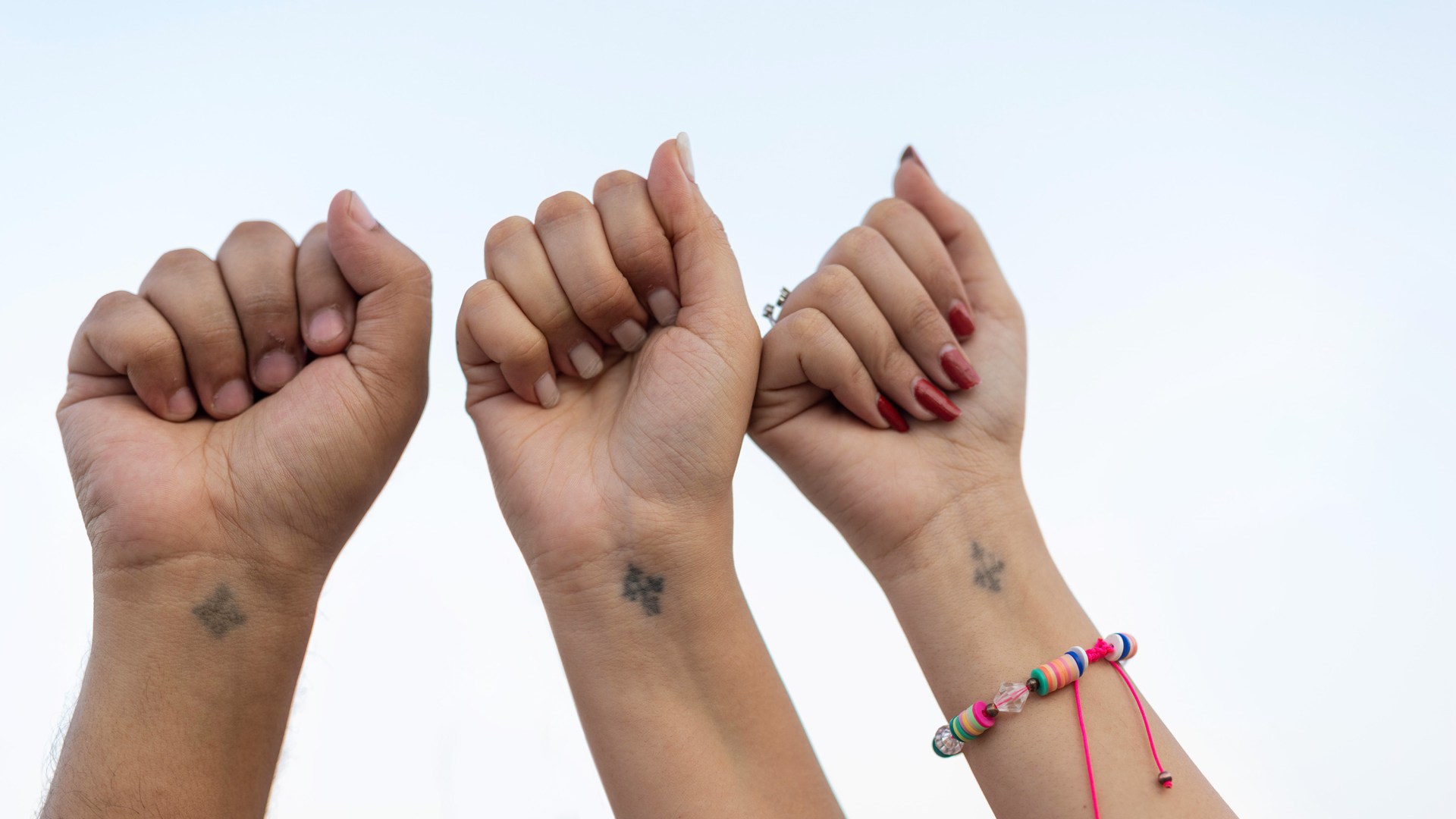 Coptic Christians in Egypt tattoo crosses on their right wrists as a symbol of their faith.