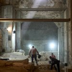 Workers from the Israel Antiquities Authority excavate a section of a city wall from the Hasmonean period in the Old City of Jerusalem.