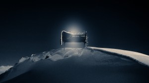 A glowing manger in snow.