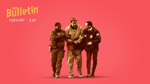 Two DEA agents walk on either side of a handcuffed Venezuelan President Nicolás Maduro.