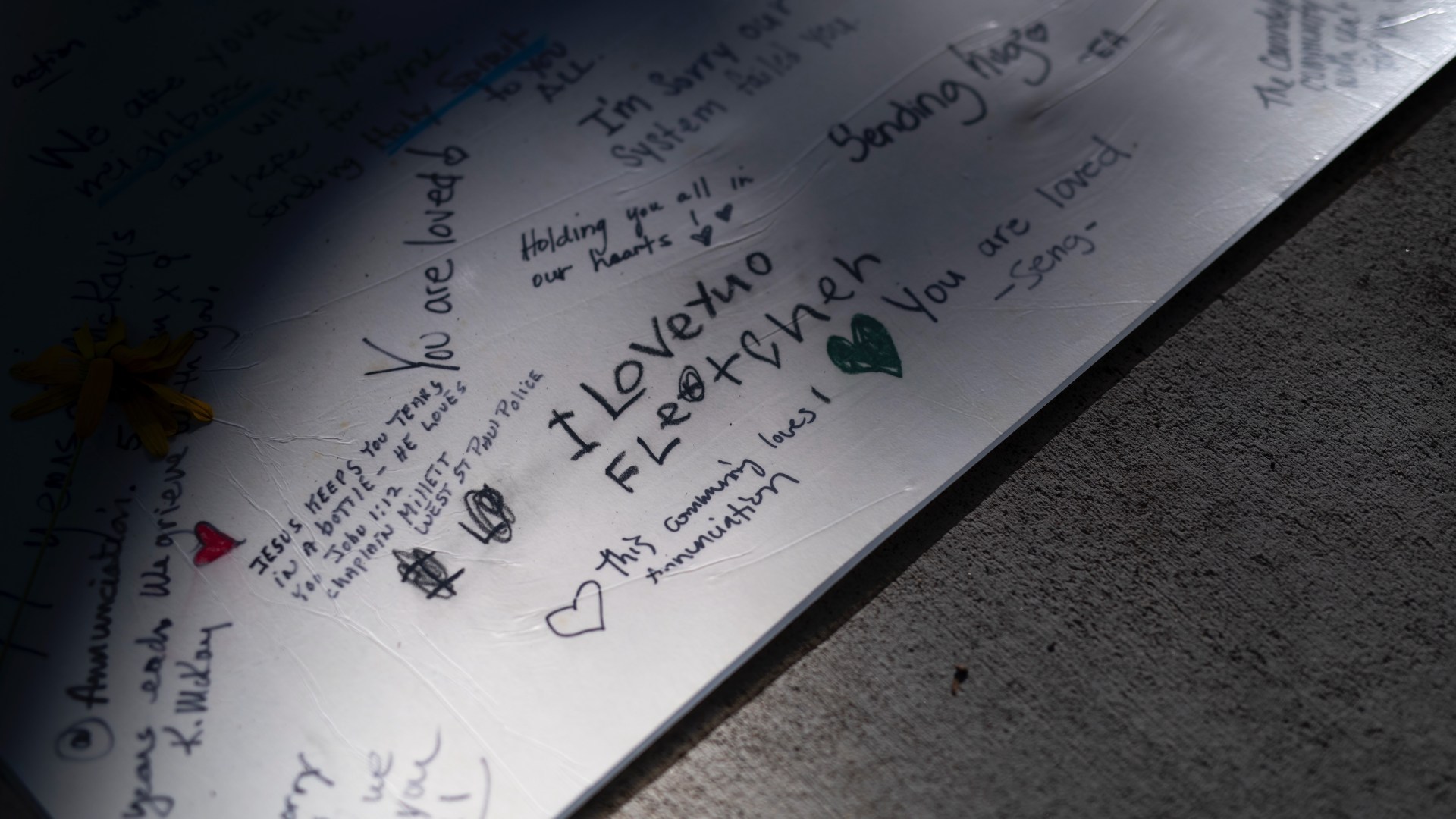 A note reading " I Love You Fletcher" is left outside Annunciation Church and School on August 30, 2025 in Minneapolis, Minnesota.
