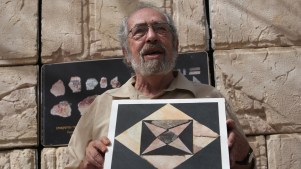Dr. Gabriel Barkay showing a restored floor tile in east Jerusalem on September 6, 2016.