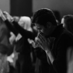 A man praying in church.