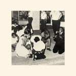 A photo of people praying at a peaceful Civil Rights protest.