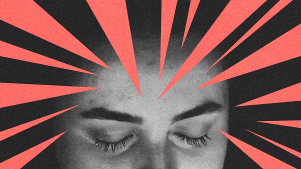 A woman's forehead with several sharp red triangles pointing at it.