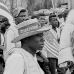 A man with a straw hat walks with others on the Selma to Montgomery marches held in support of voter rights in late March of 1965.