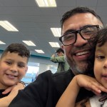 Pastor Elias Rodriguez with three children he flew to Venezuela to reunite with their mother after she was deported without them.