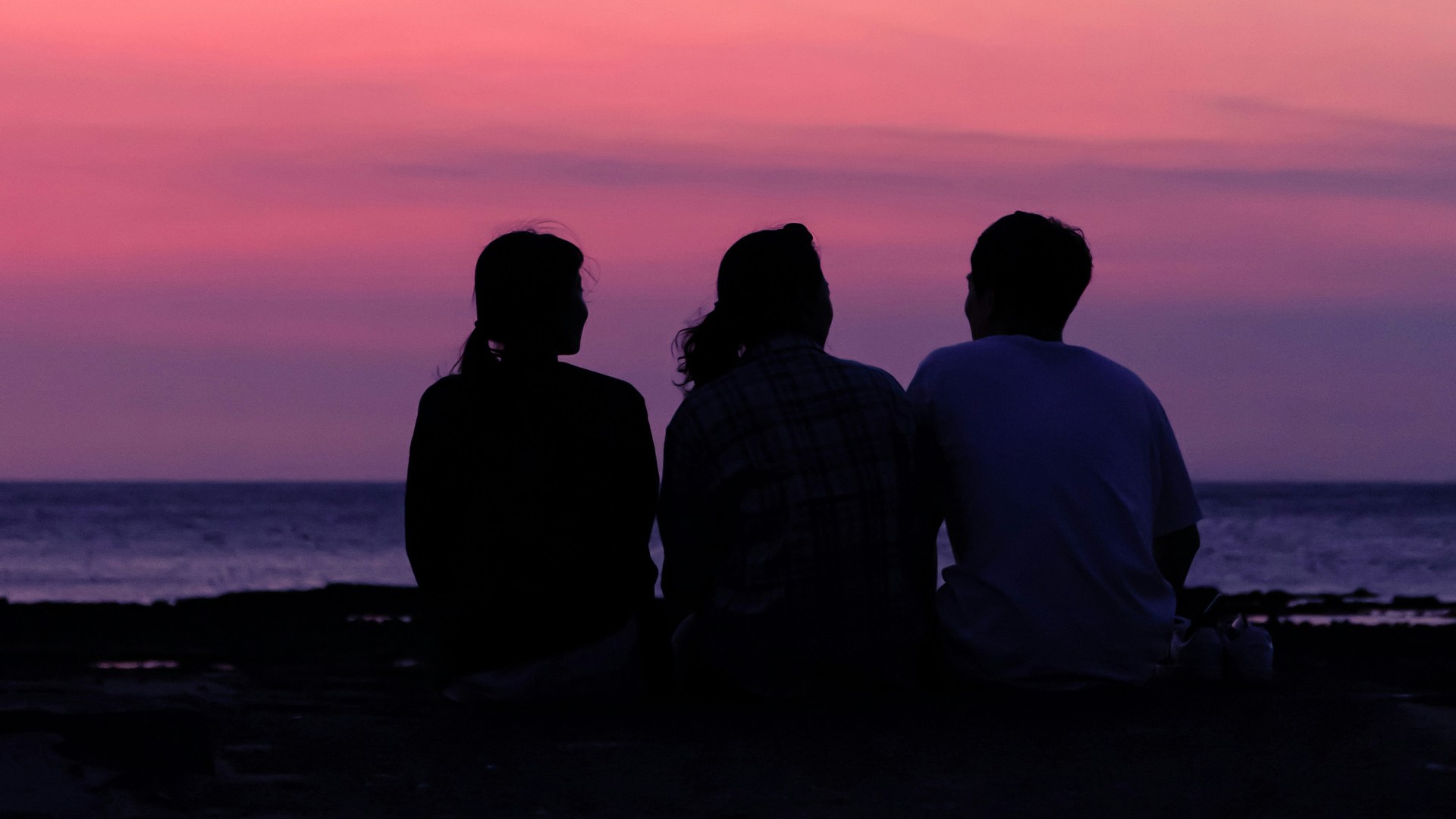 Three people in a deep conversation.