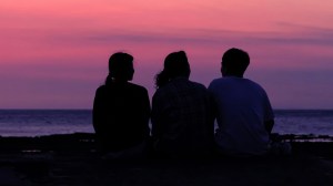 Three people in a deep conversation.