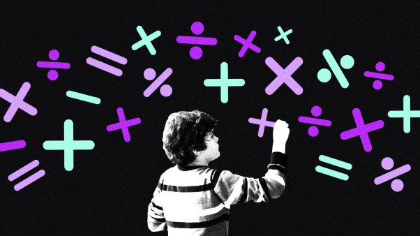 A child writing math symbols.