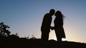 A silhouette of a couple holding hands