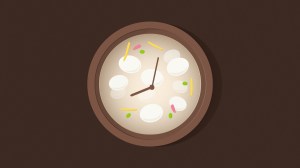 A clock face in a bowl of Tteokguk soup.