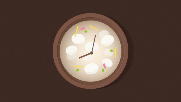 A clock face in a bowl of Tteokguk soup.