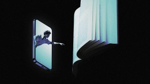 A young man in a phone reaching for a book.