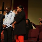 Faith leaders pray at St. John Missionary Baptist Church in Springfield, Ohio.