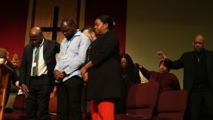Faith leaders pray at St. John Missionary Baptist Church in Springfield, Ohio.
