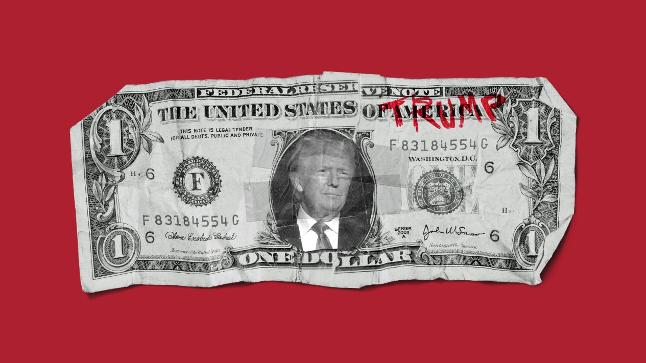 A dollar bill with Trump's name and photo on it.