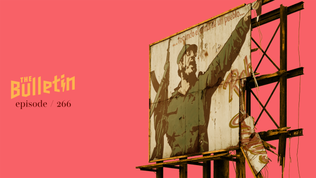 A billboard with an old propaganda poster of Fidel Castro with a machine gun.