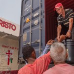 Members of the Iglesia Hermanos en Cristo Faro de Luz unloading supplies that will be distributed to people in the church and the community.