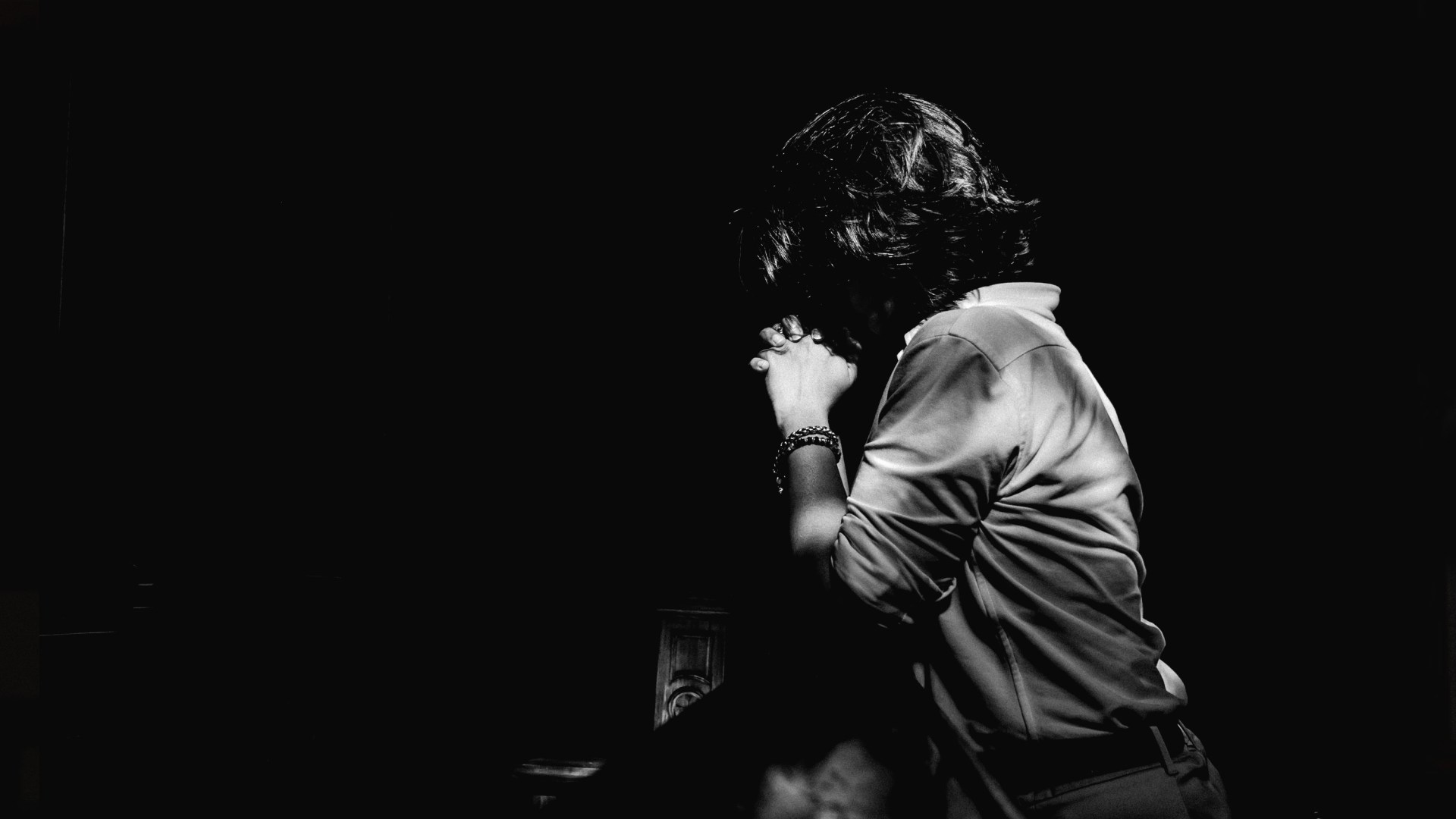 A person praying in church.