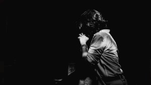 A person praying in church.