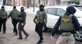 Federal agents walk through a neighborhood in Minneapolis, Minnesota on Feb. 5.