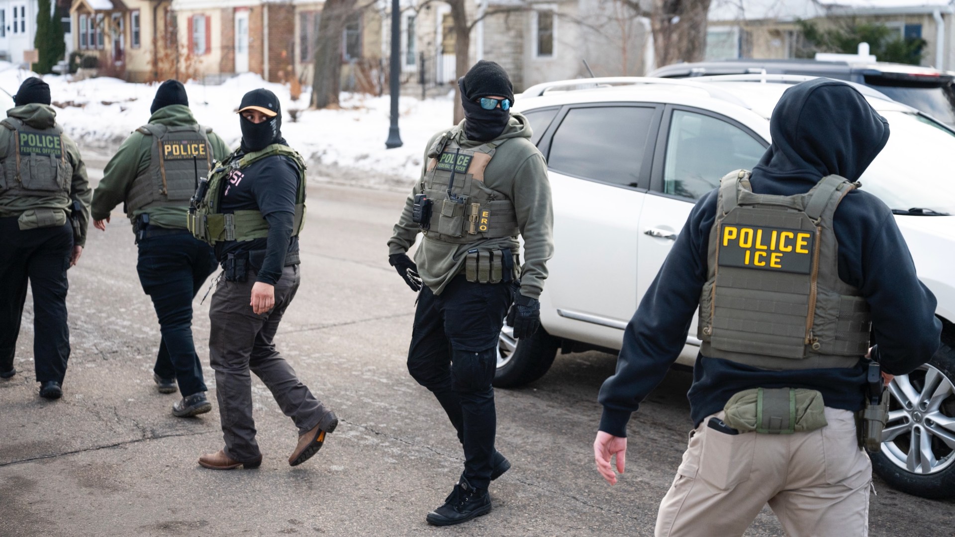 Federal agents walk through a neighborhood in Minneapolis, Minnesota on Feb. 5.
