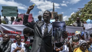 Families of Kenyans recruited illegally to fight for the Russian army in the Russia-Ukraine war hold photos of their missing relatives during a protest demanding answers in Nairobi, Kenya, on March 05, 2026.