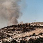 Smoke from an explosion due to Israeli bombardment rises in the hills of Rmeich in southern Lebanon.