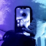 A young child on a phone.