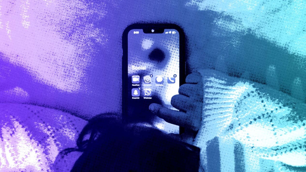 A young child on a phone.