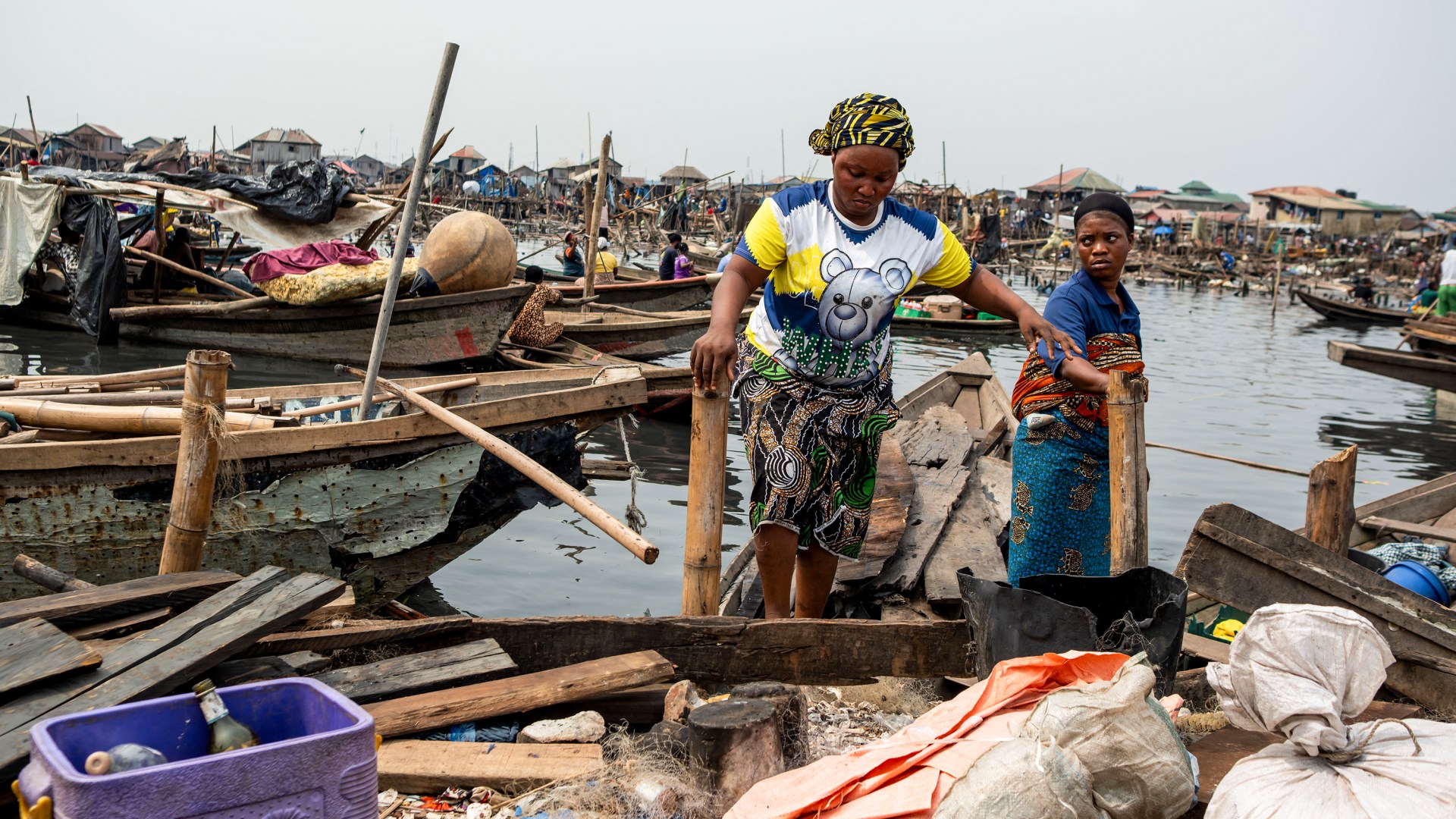 Residents evacuate in a boat following forceful eviction and demolition of homes in the Makoko slum in Nigeria.