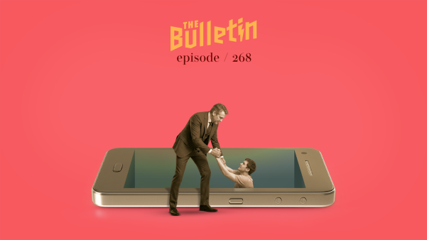 A man pulling another man out of a hole that is shaped like a cell phone.