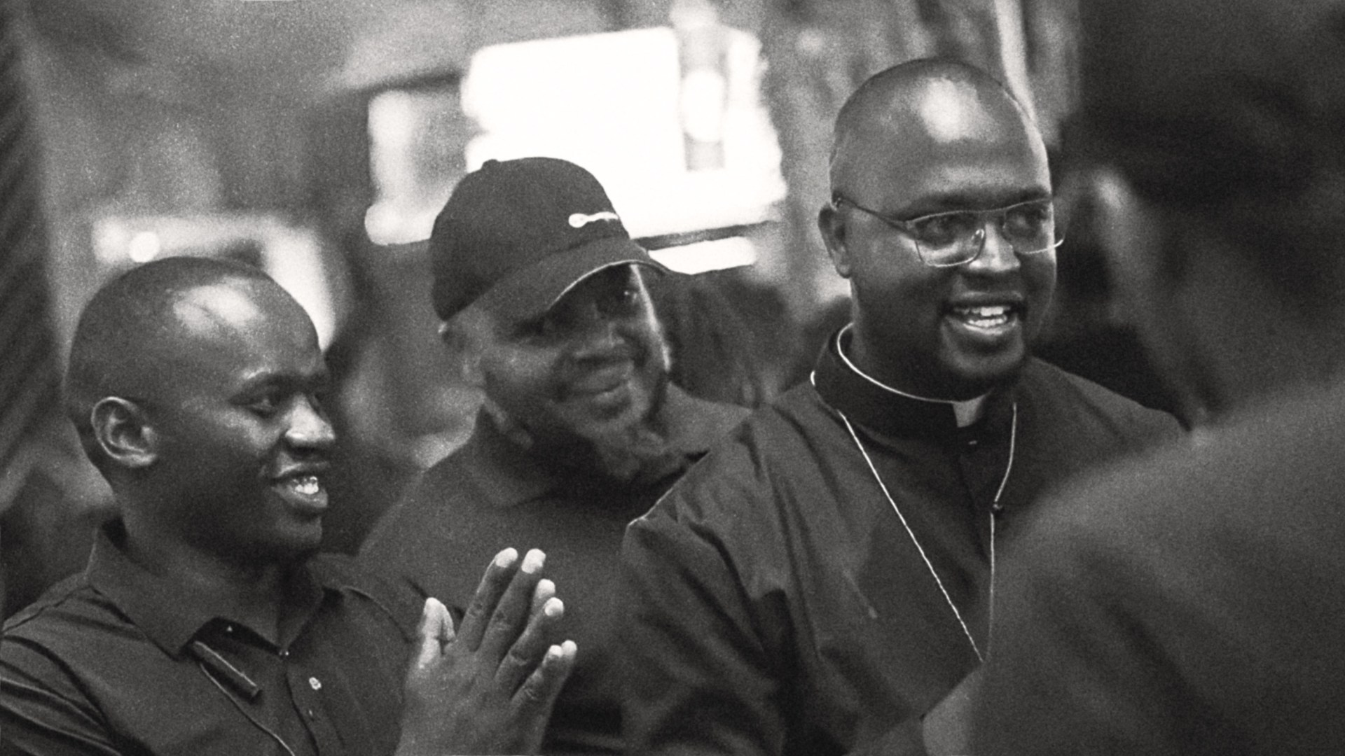 Padre Micheal Watenga preaching in a nightclub.