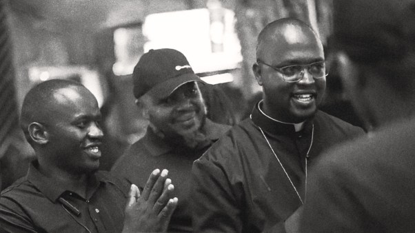 Padre Micheal Watenga preaching in a nightclub.