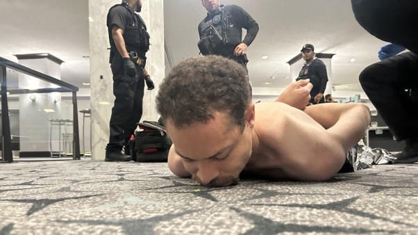 Law enforcement detaining a suspect following a shooting incident at the White House Correspondents' Dinner in Washington, D.C. on the night of April 25, 2026.