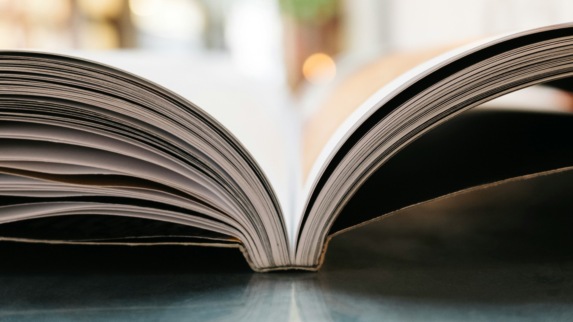 An open book on a table.