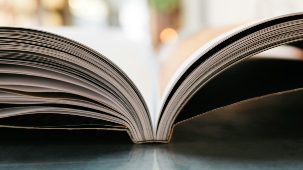 An open book on a table.