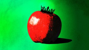 An apple, representing original sin, with a black crown on it.